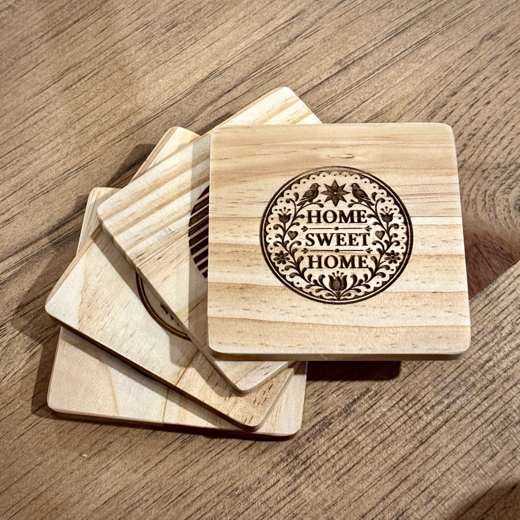 Sous-verres en bois gravés, huard et forêt